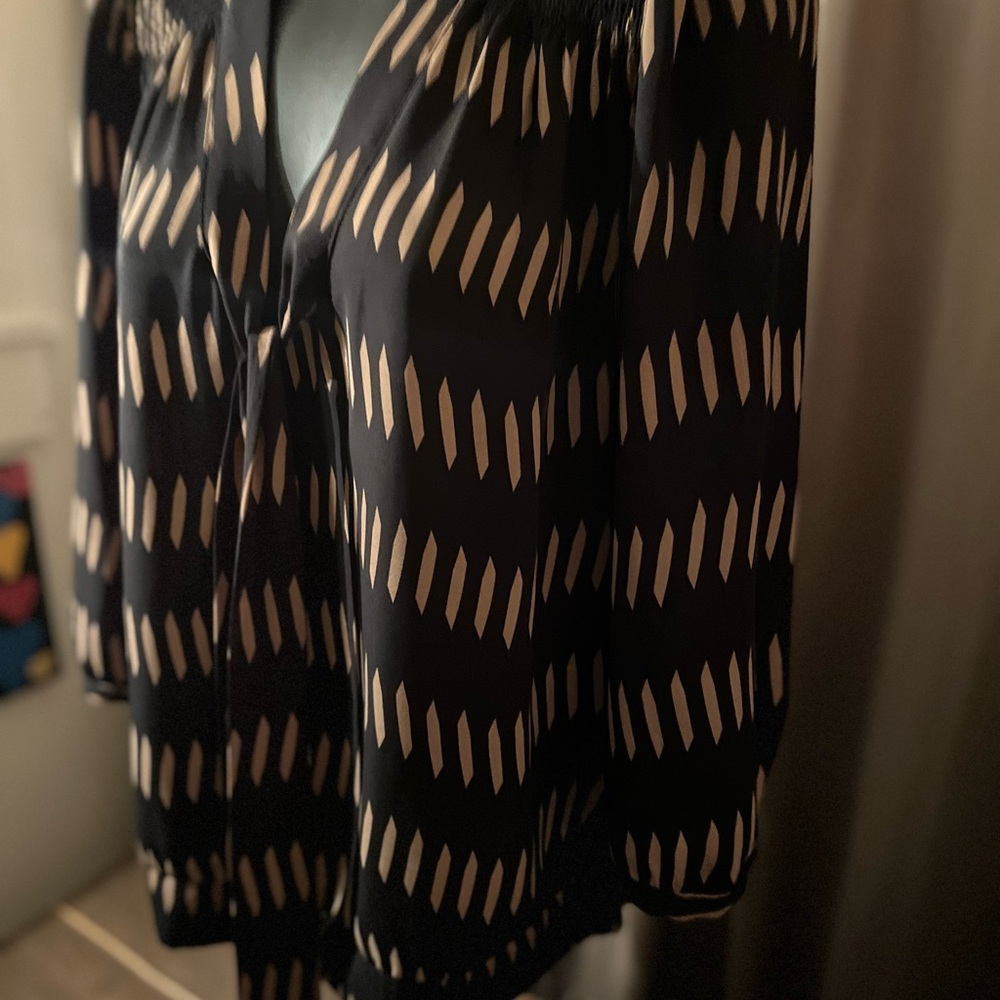 The limited black tie neck gold stripe top with 3/4 length sleeves